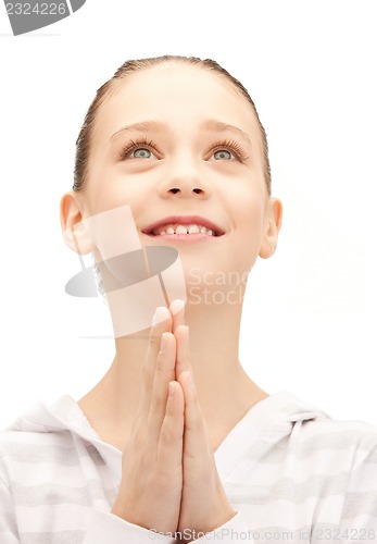 Image of praying teenage girl