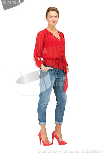 Image of lovely woman in red blouse and jeans