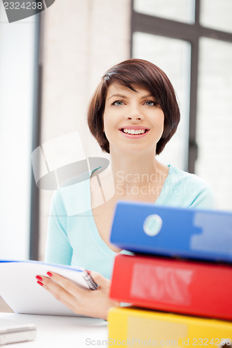 Image of woman with folders