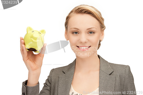 Image of lovely woman with piggy bank