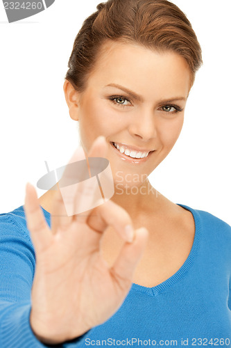 Image of lovely teenage girl showing ok sign