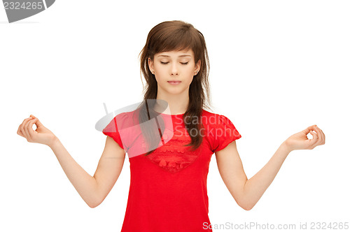 Image of teenage girl in meditation