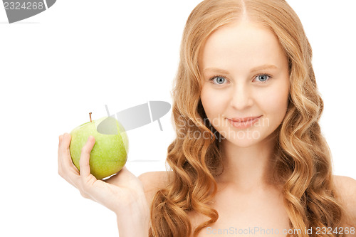Image of young beautiful woman with green apple