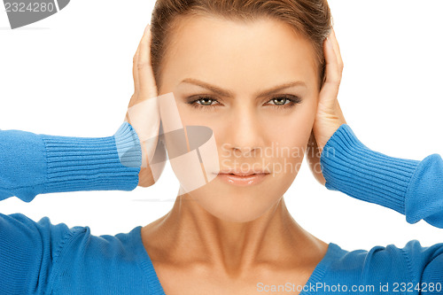 Image of woman with hands on ears