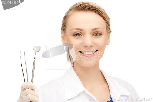 Image of dentist with tools