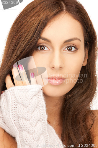 Image of beautiful woman in mittens