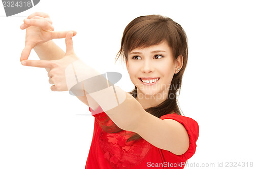 Image of teenage girl creating a frame with fingers