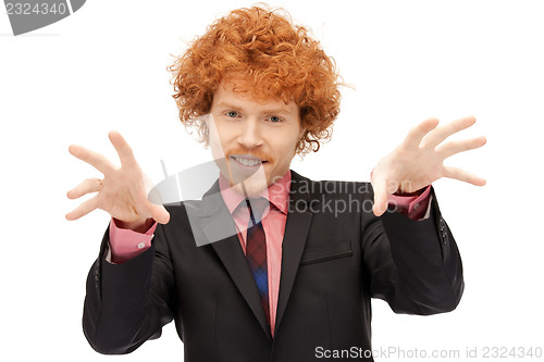 Image of businessman working with something imaginary