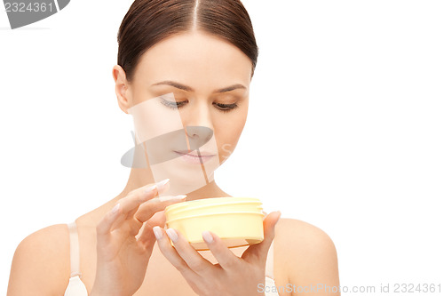 Image of beautiful woman with moisturizing creme