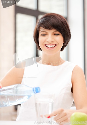 Image of beautiful woman with glass of water