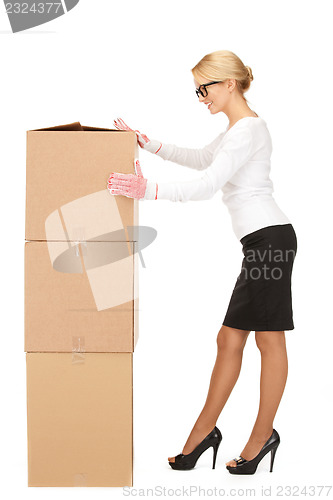 Image of attractive businesswoman with big boxes
