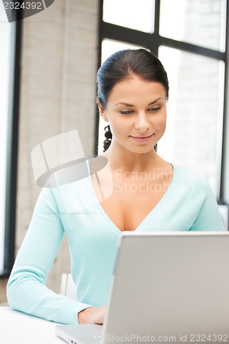 Image of happy woman with laptop computer