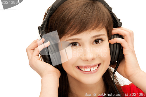 Image of happy teenage girl in big headphones