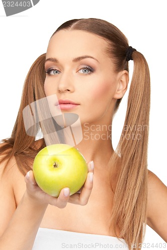 Image of young beautiful woman with green apple