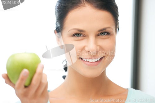 Image of lovely housewife with green apple