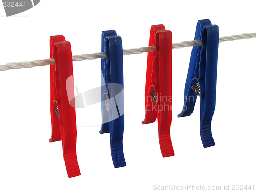 Image of Blue and red clothespins on a clothes line (+ clipping path)