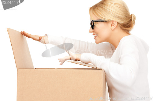 Image of attractive businesswoman with cardboard box