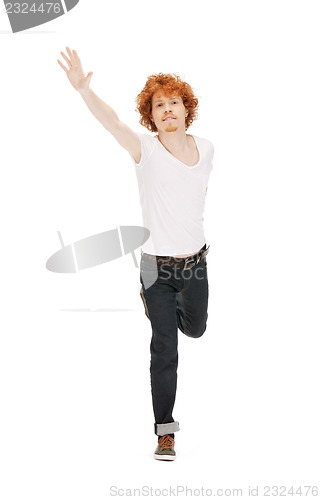 Image of jumping man in  white shirt