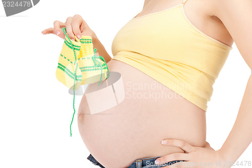 Image of pregnant woman belly and socks