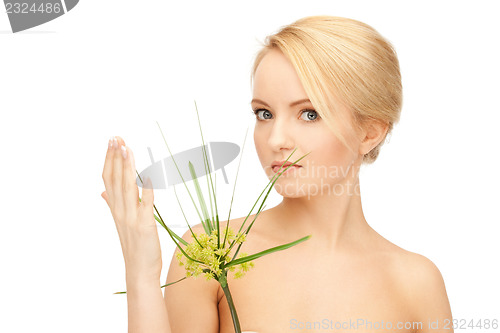 Image of woman with green sprout