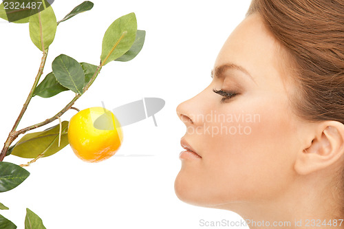 Image of lovely woman with lemon twig