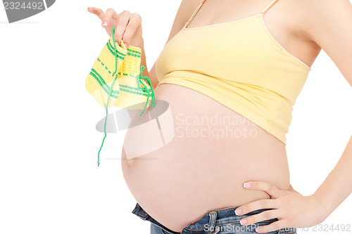 Image of pregnant woman belly and socks