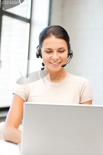 Image of helpline operator with laptop computer
