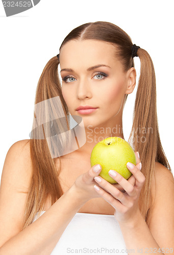 Image of young beautiful woman with green apple
