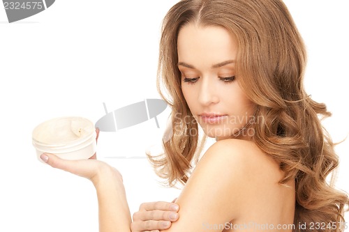Image of beautiful woman with moisturizing creme