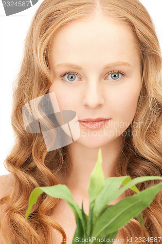 Image of woman with green sprout