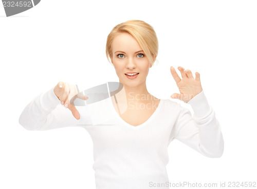 Image of businesswoman working with something imaginary