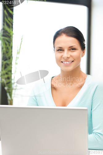 Image of happy woman with laptop computer