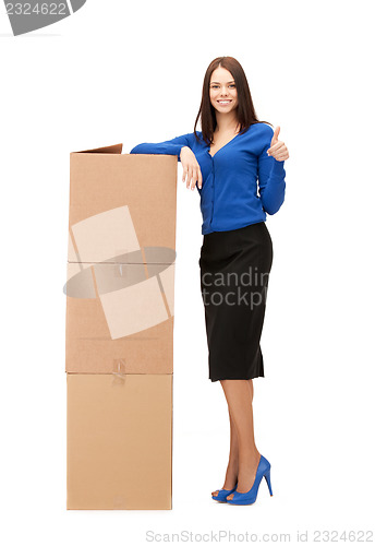 Image of attractive businesswoman with big boxes