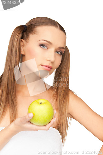 Image of young beautiful woman with green apple
