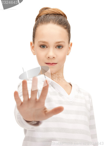 Image of teenage girl making stop gesture