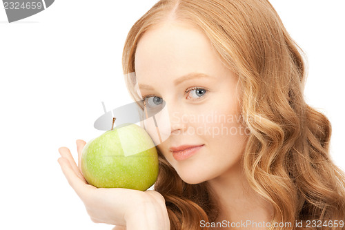 Image of young beautiful woman with green apple