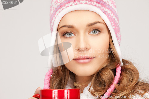 Image of woman with red mug