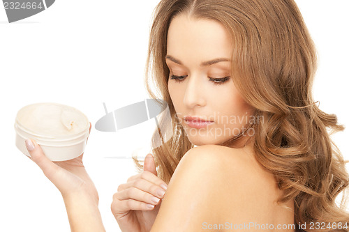 Image of beautiful woman with moisturizing creme