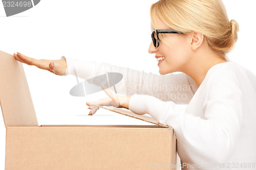 Image of attractive businesswoman with cardboard box