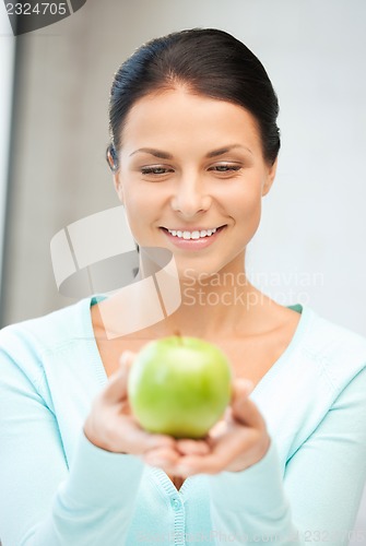 Image of lovely housewife with green apple