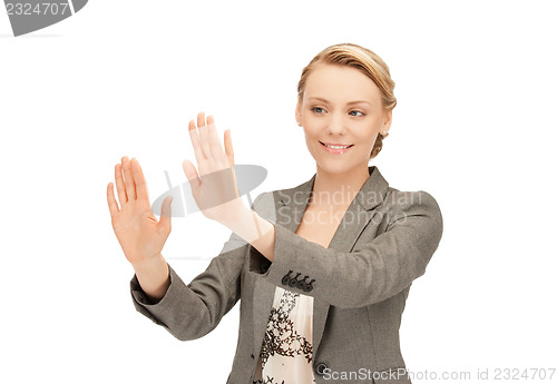 Image of businesswoman working with something imaginary