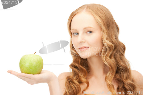 Image of young beautiful woman with green apple