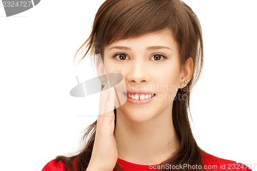 Image of teenage girl whispering gossip