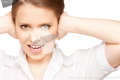 Image of woman with hands on ears