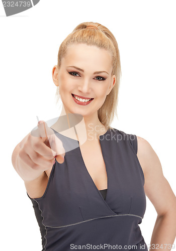 Image of lovely fitness instructor pointing her finger