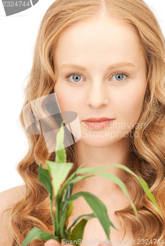 Image of woman with green sprout