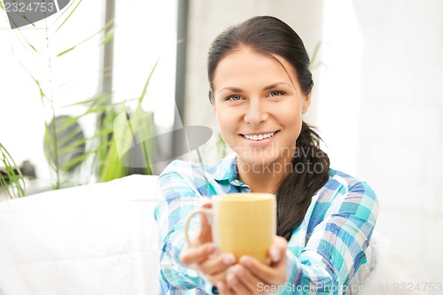 Image of lovely housewife with mug