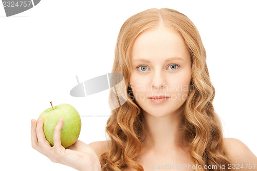 Image of young beautiful woman with green apple