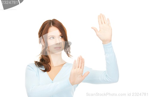 Image of businesswoman working with something imaginary