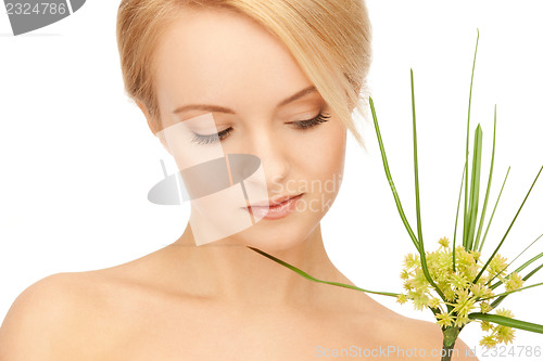 Image of woman with green sprout
